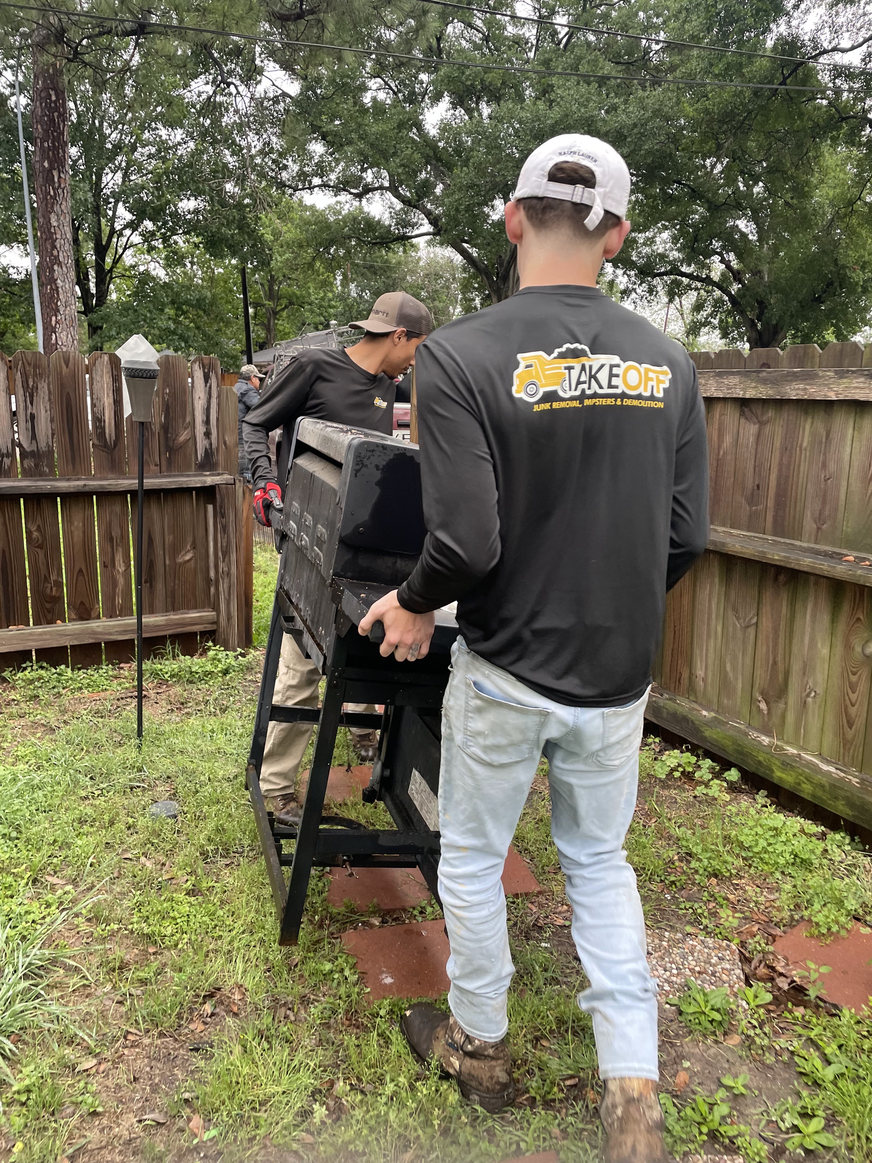 The TAKEOFF crew and truck ready to haul junk in Houston